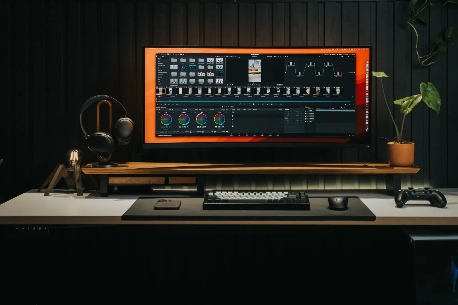 Sleek home office with a powerful video editing workstation and gaming console, perfect for creators