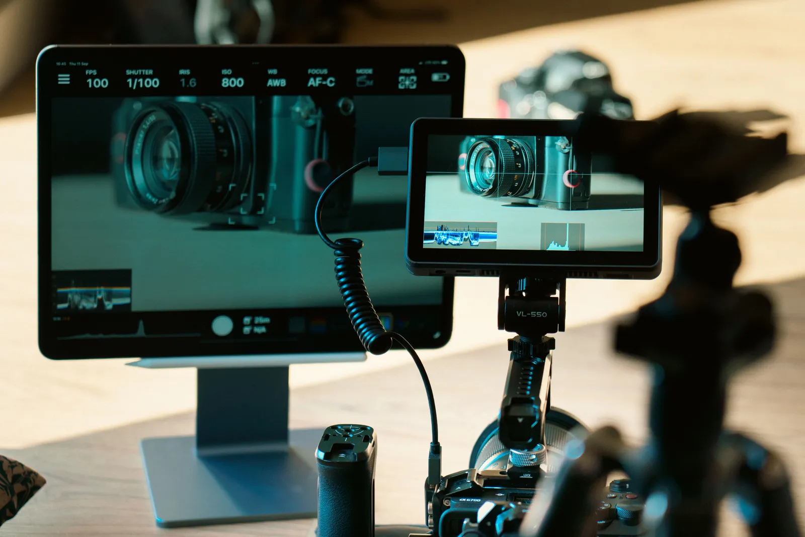 Camera and monitor setup for video production and photography editing in a studio