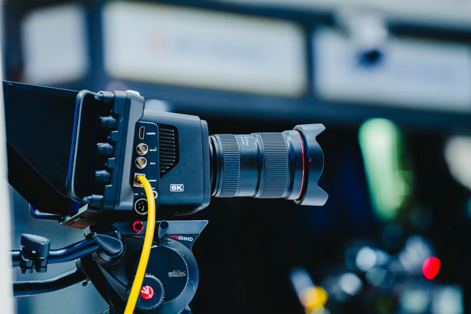 Close-up shot of a professional 6K video camera mounted on a tripod, ideal for filming and video production