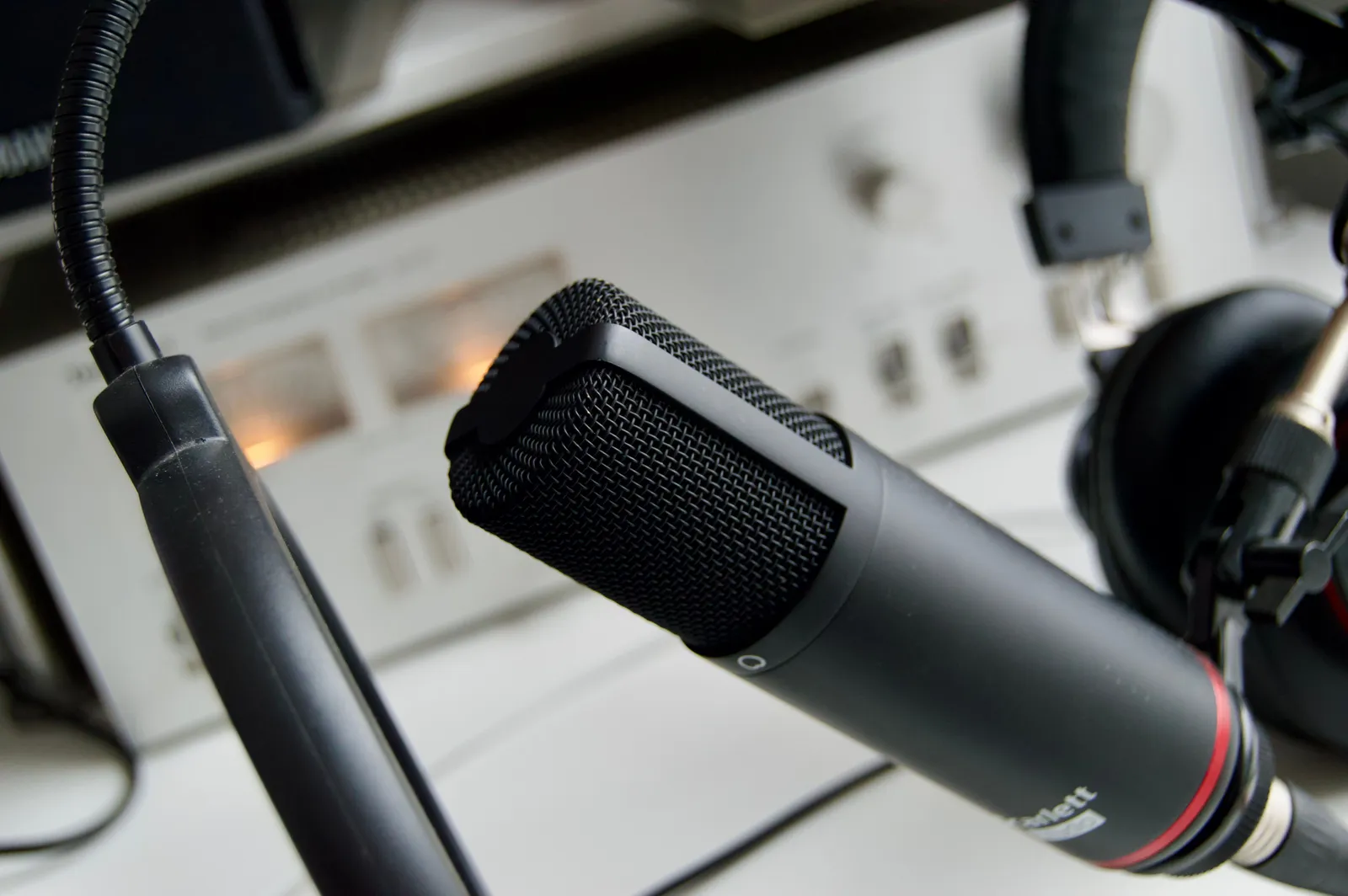 Close-up shot of a microphone in a studio setting, ideal for audio recording