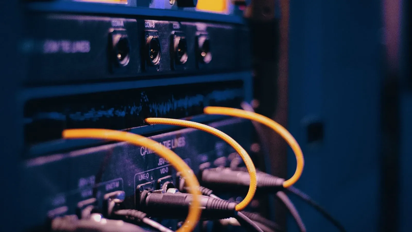 Ethernet cables connected to ports on a network rack