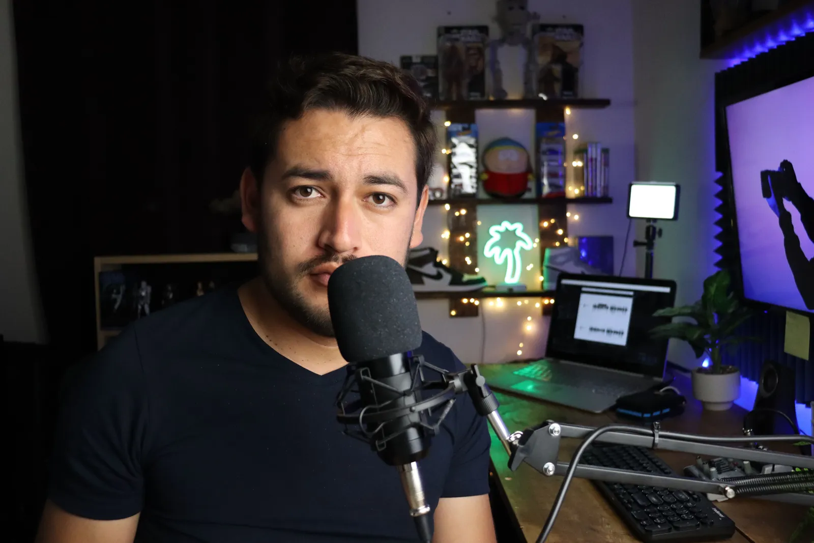 Podcaster in a stylish home studio with microphone and neon lights in Santiago de Querétaro, Mexico