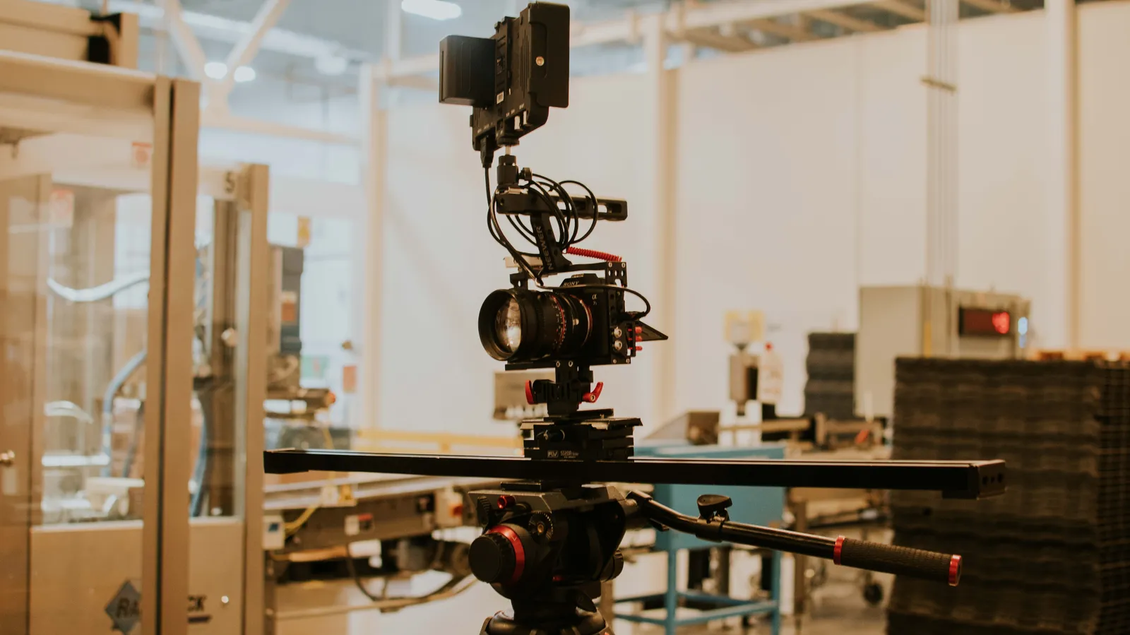 Detailed view of a camera rig set up for professional filming inside a studio setting